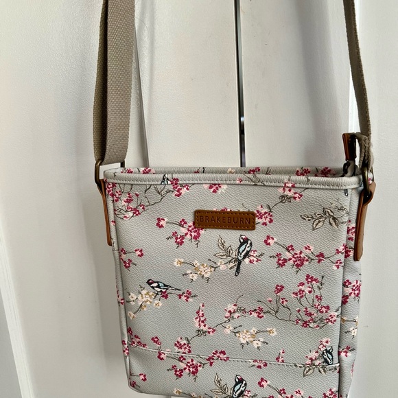 Brakeburn robin’s egg blue/gray cross body with a bird and a pink floral motif. - Picture 3 of 6